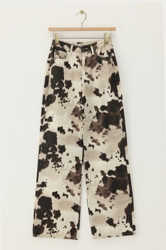 Jean large avec imprimé vache | - My jewellery - Modalova