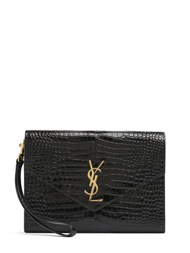 Cassandre Embossed Leather Clutch - SAINT LAURENT - Modalova