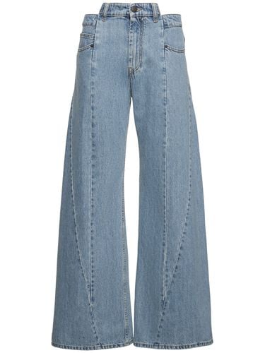 Jeans Larghi Asimmetrici In Di Cotone - MAISON MARGIELA - Modalova