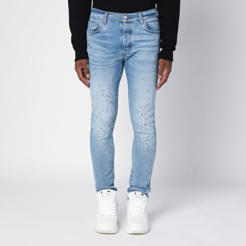 Hellblaue Skinny Jeans mit ausgewaschener Optik und Used-Details - AMIRI - Modalova