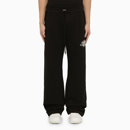 Pantalone jogging nero con logo - AMIRI - Modalova