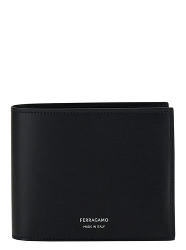 Bi-fold Wallet With Embossed Logo In Smooth Leather Man - Ferragamo - Modalova