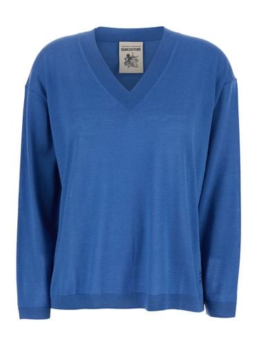 Blue Sweater With V-neck And Logo Embroidered On The Side In Virgin Wool Woman - SEMICOUTURE - Modalova