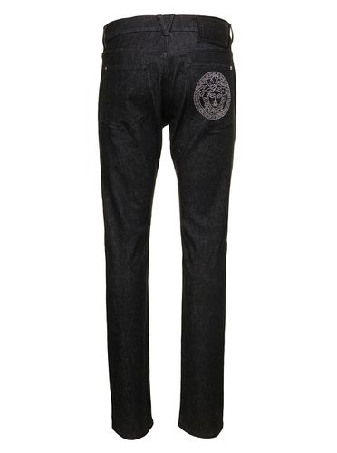Straight Jeans With Studded Medusa In Stretch Cotton Denim Man - Versace - Modalova