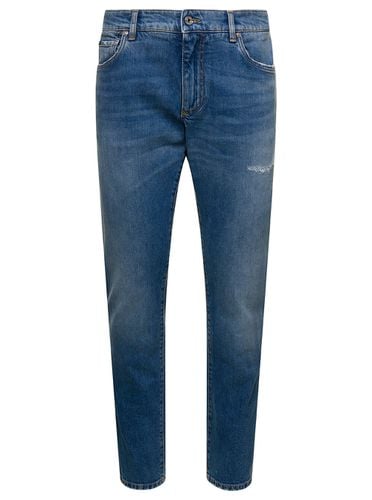 Light Five-pockets Slim Jeans With Logo Plaque In Stretch Cotton Denim Man - Dolce & Gabbana - Modalova