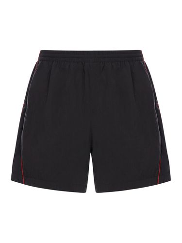 BERMUDA SHORTS IN TECHNICAL FABRIC WITH LOGO - Man - Balenciaga - Modalova