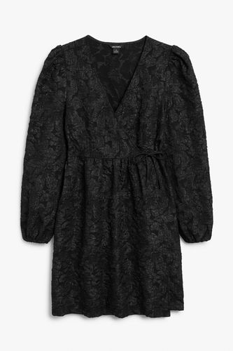 Schwarzes Babydoll-Wickelkleid aus Jacquard Schwarz, Alltagskleider in Größe XS. Farbe: - Monki - Modalova