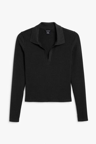 Geripptes schwarzes Poloshirt mit langen Ärmeln Schwarz, Poloshirts in Größe XS. Farbe: - Monki - Modalova