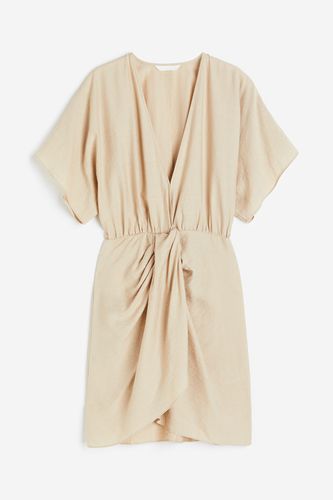 Kleid mit V-Ausschnitt Hellbeige, Alltagskleider in Größe XS. Farbe: - H&M - Modalova