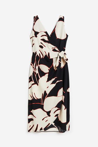 Wickelkleid mit V-Ausschnitt Schwarz/Blätter, Alltagskleider in Größe M. Farbe: - H&M - Modalova