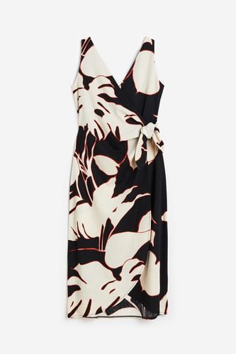 Wickelkleid mit V-Ausschnitt Schwarz/Blätter, Alltagskleider in Größe XS. Farbe: - H&M - Modalova