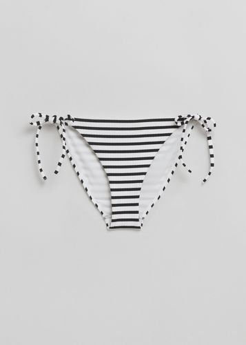 Bikinihose mit seitlichen Bindebändern Schwarz/Weißgelb, Bikini-Unterteil in Größe 44. Farbe: - & Other Stories - Modalova