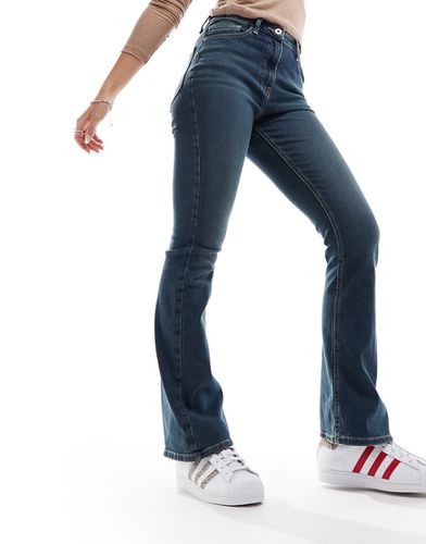 X007 - Jeans a zampa elasticizzati lavaggio medio - Collusion - Modalova