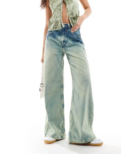 X013 - Jeans con fondo ampio a vita medio alta lavaggio - Collusion - Modalova