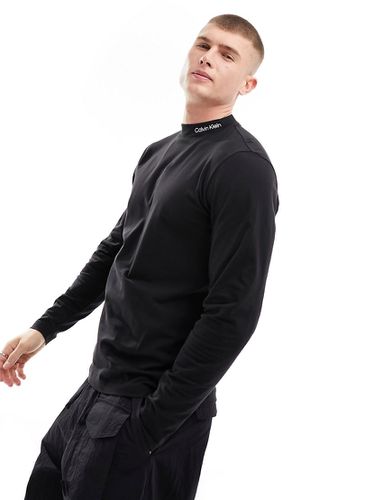 Maglietta nera a lupetto con maniche lunghe e logo - Calvin Klein - Modalova