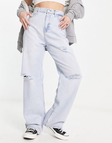 Jeans a fondo ampio e vita alta lavaggio chiaro con strappi - Calvin Klein Jeans - Modalova