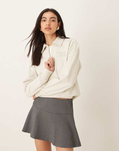Polo à logo avec manches longues et col zippé - Écru - Calvin Klein Jeans - Modalova