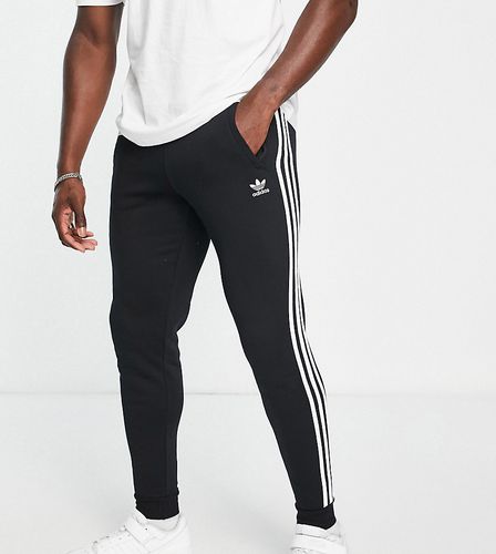 Tall - adicolor - Joggers slim neri con 3 strisce - adidas Originals - Modalova