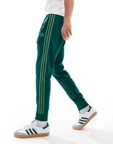 Adicolor Classics SST - Pantaloni sportivi verdi - adidas Originals - Modalova