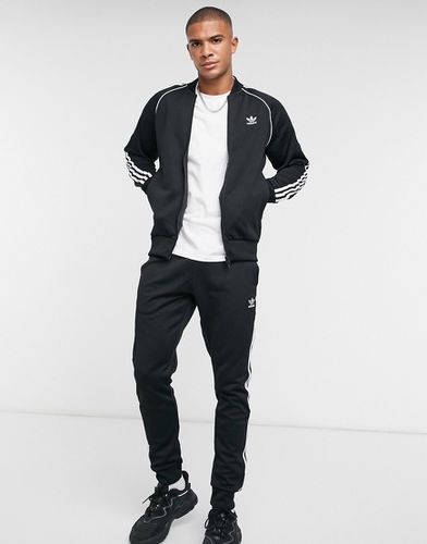 Adicolor Superstar - Joggers neri con tre strisce - adidas Originals - Modalova