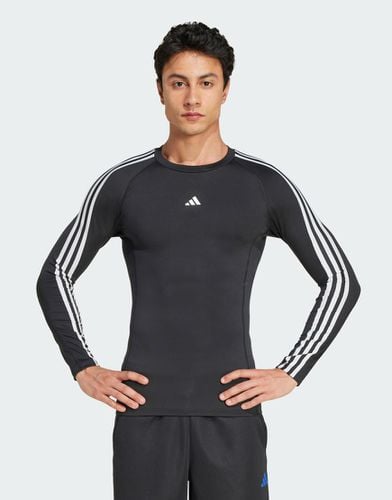 Adidas - Training Techfit - Top a maniche lunghe a compressione con 3 strisce - adidas performance - Modalova