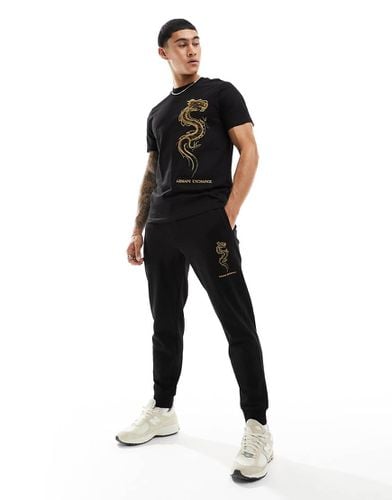 Joggers felpati neri con ricamo a forma di drago con logo - Armani Exchange - Modalova