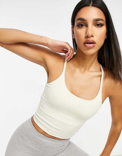 Crop top da yoga con spalline sottili e reggiseno interno - ASOS - Modalova