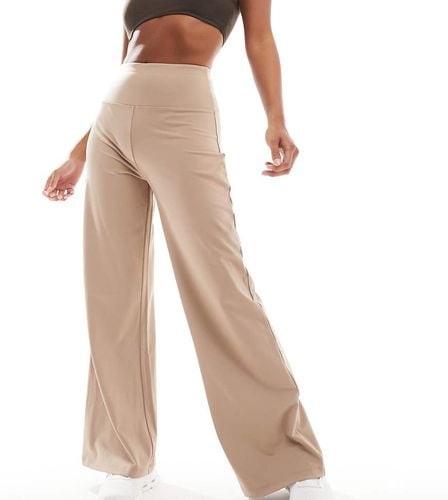 Petite - Icon - Pantaloni da danza beige a fondo ampio morbidi al tatto - ASOS - Modalova