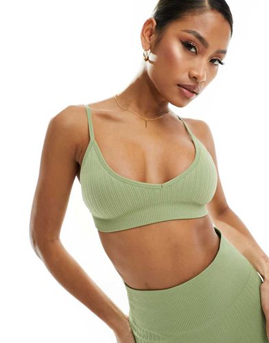 Reggiseno sportivo a supporto leggero senza cuciture color pistacchio a coste con imbottitura rimovibile - ASOS - Modalova