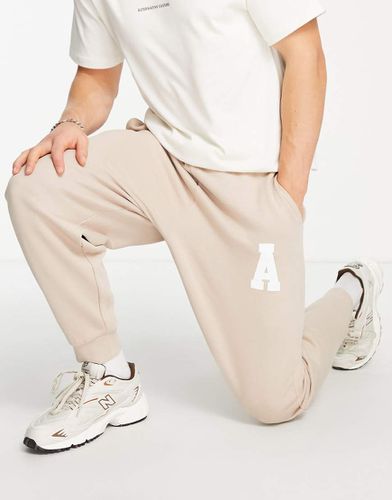 ASOS Actual - Athleisure - Joggers comodi color sabbia con logo in coordinato - ASOS DESIGN - Modalova