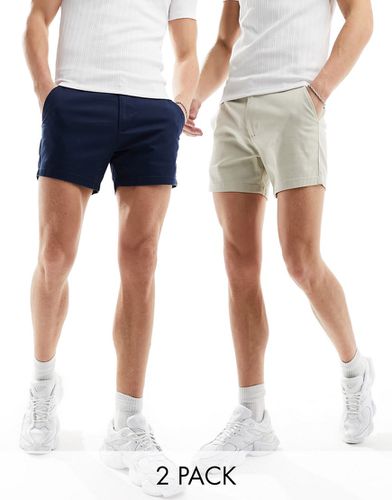 Confezione da 2 paia di pantaloncini chino skinny taglio corto blu navy e color pietra - ASOS DESIGN - Modalova
