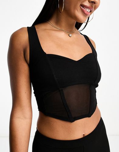Canotta nera con dettaglio stile corsetto in rete e scollo a cuore - ASOS DESIGN - Modalova