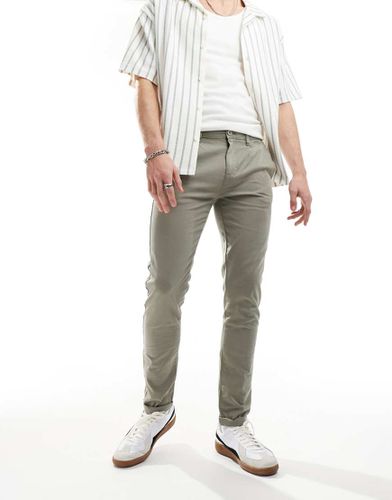 Chino skinny color kaki slavato - ASOS DESIGN - Modalova