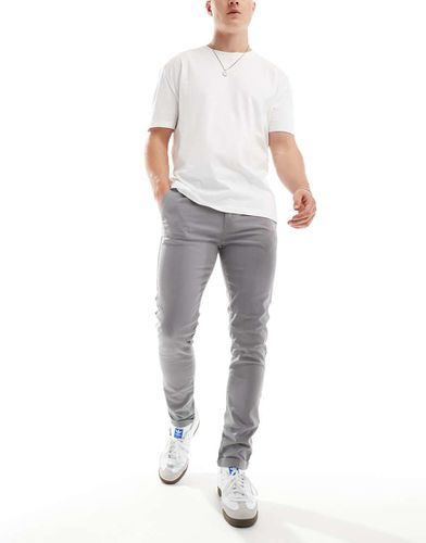 Chino skinny slavato - ASOS DESIGN - Modalova