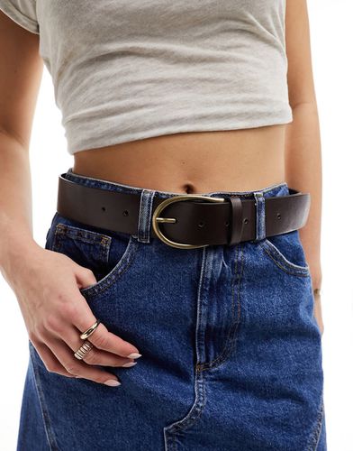 Cintura da jeans per vita e fianchi con fibbia a mezzaluna - ASOS DESIGN - Modalova