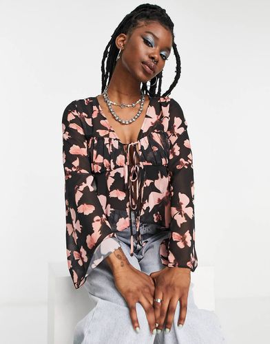 Blusa trasparente con stampa a farfalle, maniche voluminose e busto a corsetto - ASOS DESIGN - Modalova