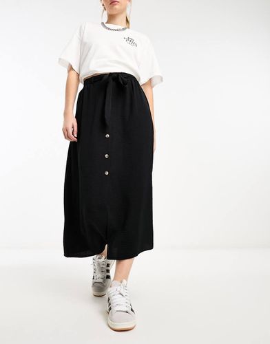 Gonna midi nera allacciata in vita con bottoni - ASOS DESIGN - Modalova