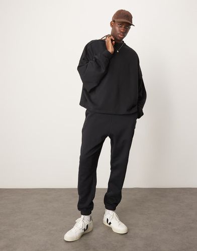 Essential - Joggers oversize neri - ASOS DESIGN - Modalova