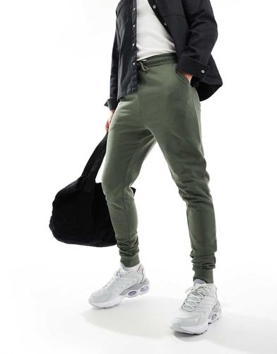 Essential - Joggers skinny verdi - ASOS DESIGN - Modalova