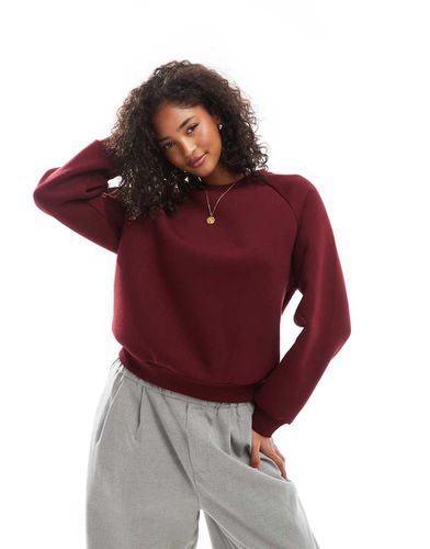 Felpa bordeaux con maniche raglan - ASOS DESIGN - Modalova