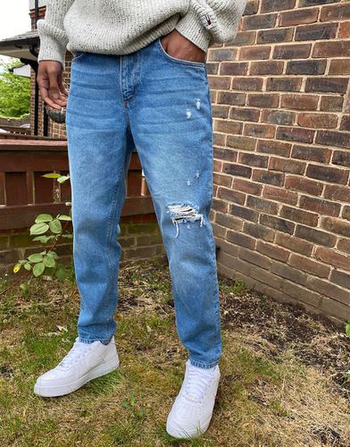 Jeans classici rigidi medio slavato con strappi - ASOS DESIGN - Modalova