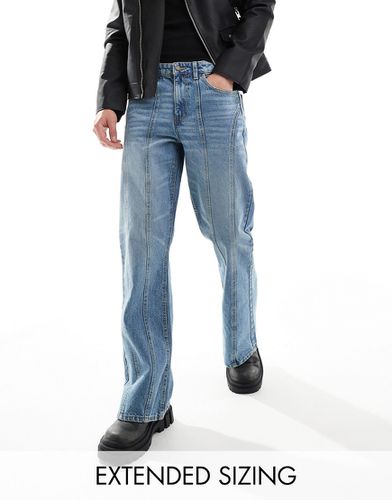 Jeans ampi a zampa lavaggio medio con pannelli - ASOS DESIGN - Modalova