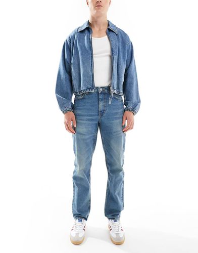 Jeans affusolati lavaggio medio - ASOS DESIGN - Modalova