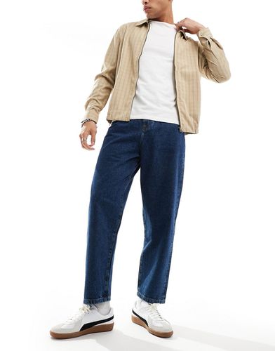 Jeans a palloncino lavaggio medio - ASOS DESIGN - Modalova