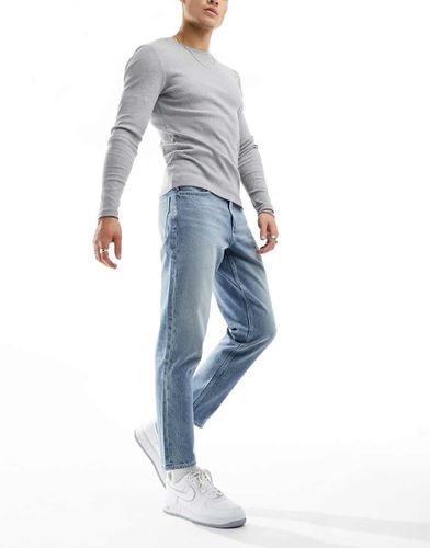 Jeans affusolati lavaggio azzurro - ASOS DESIGN - Modalova