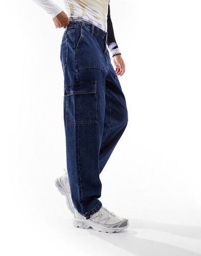 Jeans extra larghi lavaggio scuro con tasche cargo - ASOS DESIGN - Modalova