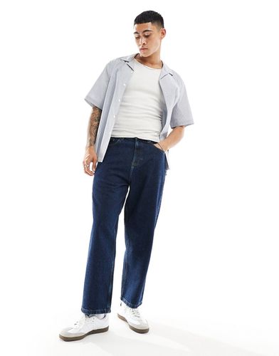 Jeans oversize affusolati lavaggio scuro - ASOS DESIGN - Modalova
