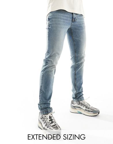 Jeans skinny azzurri sfumati - ASOS DESIGN - Modalova