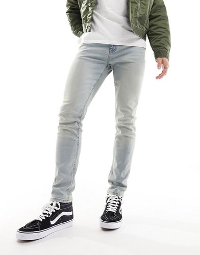 Jeans skinny lavaggio chiaro tinto - ASOS DESIGN - Modalova
