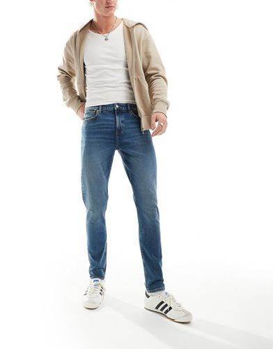 Jeans skinny lavaggio medio vintage - ASOS DESIGN - Modalova